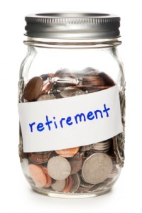 Jar of Coins Labeled Retirement on White
